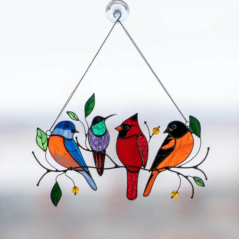 Glass window decorations in the shape of birds