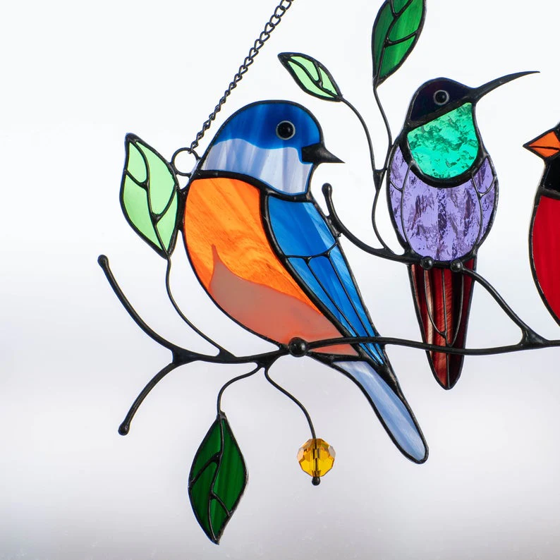 Glass window decorations in the shape of birds