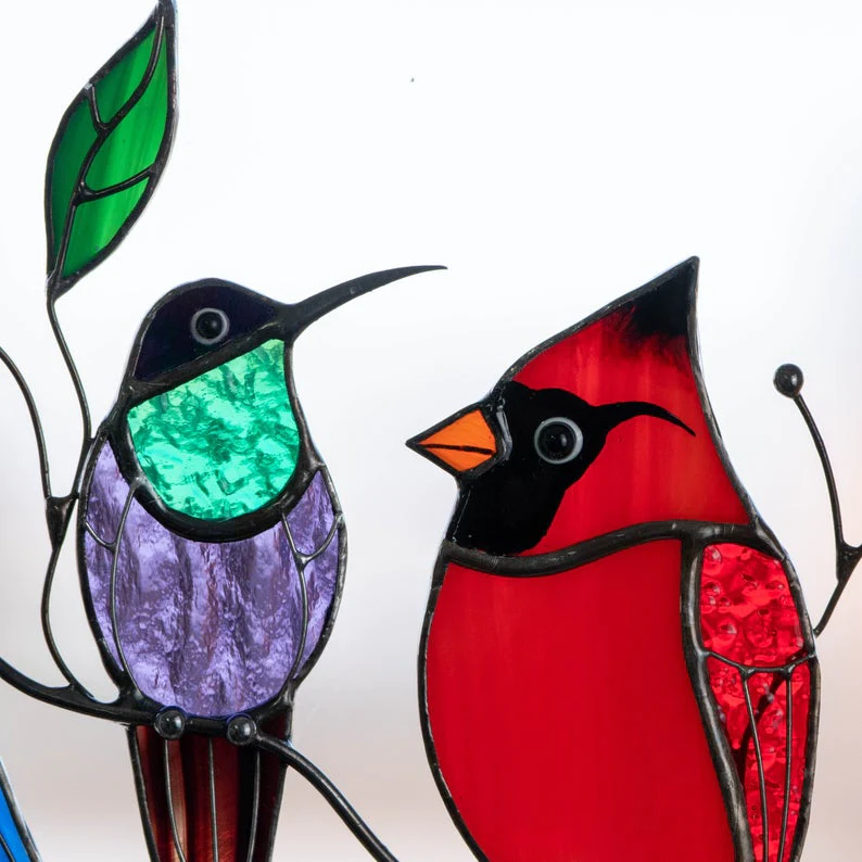 Glass window decorations in the shape of birds