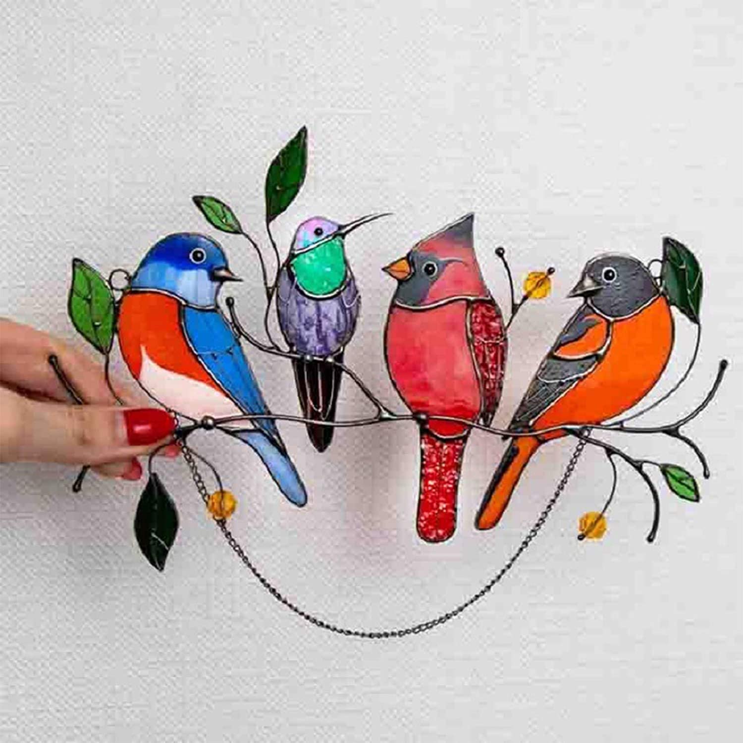 Glass window decorations in the shape of birds