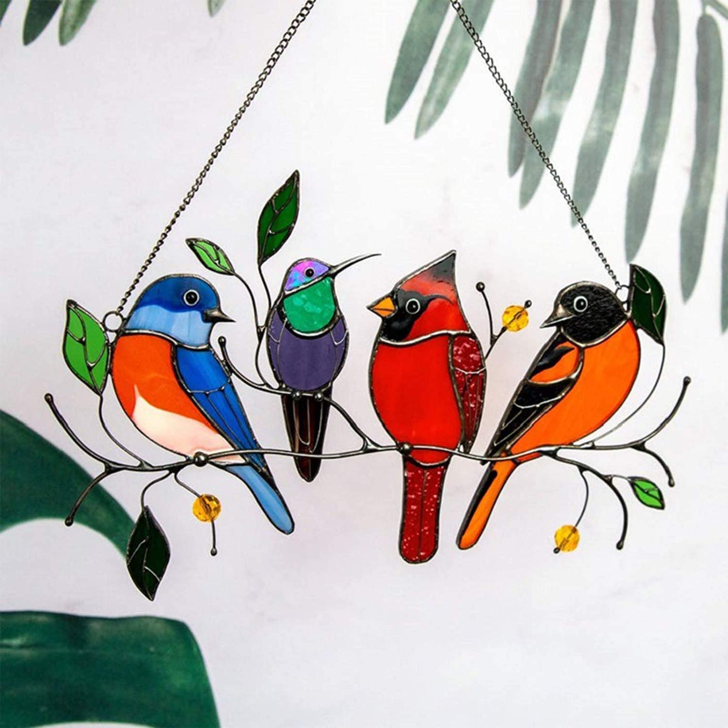 Glass window decorations in the shape of birds