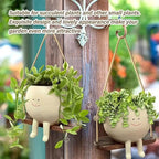 Hanging planter with smiling face