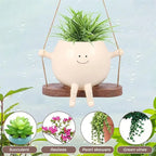 Hanging planter with smiling face