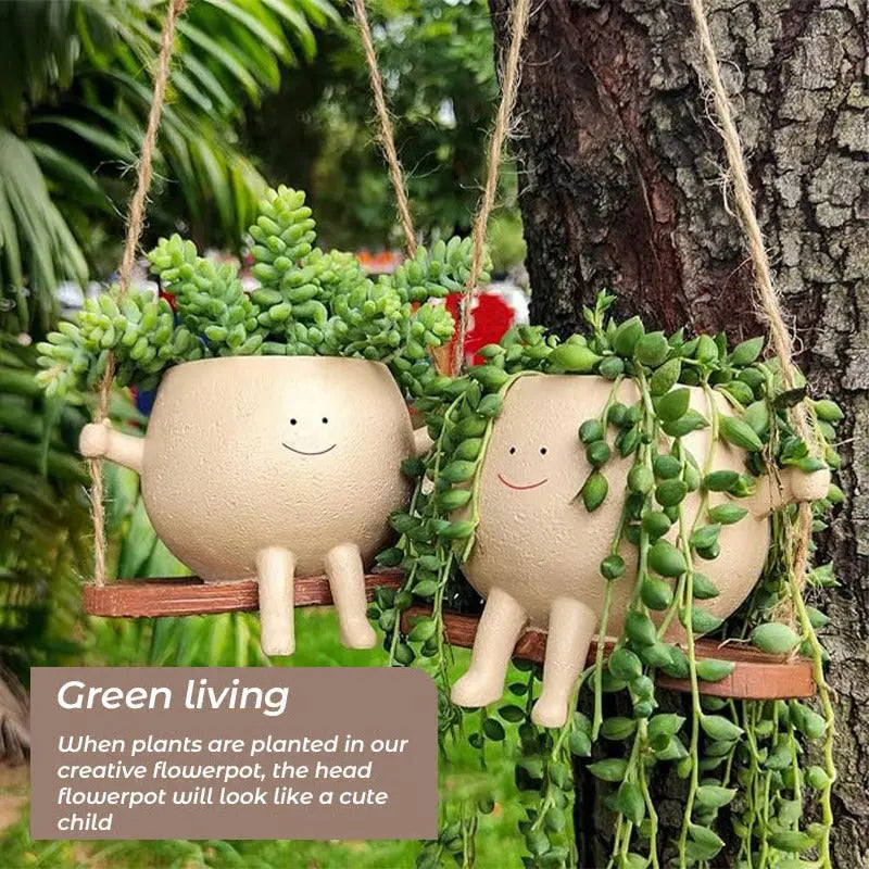 Hanging planter with smiling face