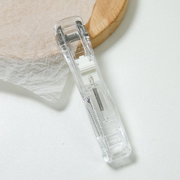 Mini-stapler — Reusable tool for stapling paper without damage