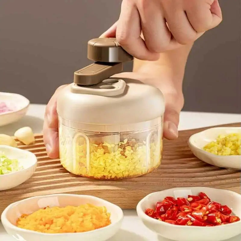 Manual food grinder with a button for quick chopping and grinding