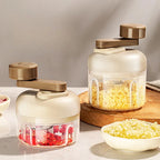 Manual food grinder with a button for quick chopping and grinding