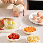 Manual food grinder with a button for quick chopping and grinding