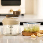 Manual food grinder with a button for quick chopping and grinding
