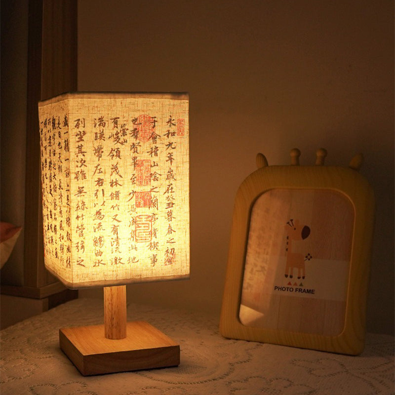 LED table lamp in a square design – wooden base with Japanese pattern