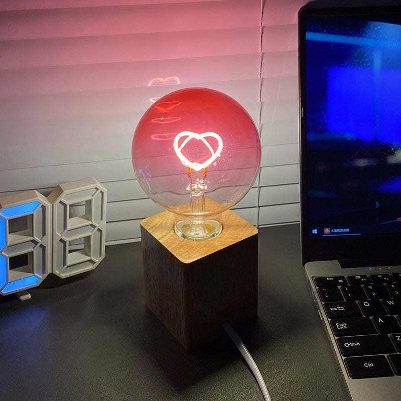 Pink LED light bulb with heart pattern – gradient