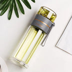 Double-walled glass bottle with tea strainer and infuser
