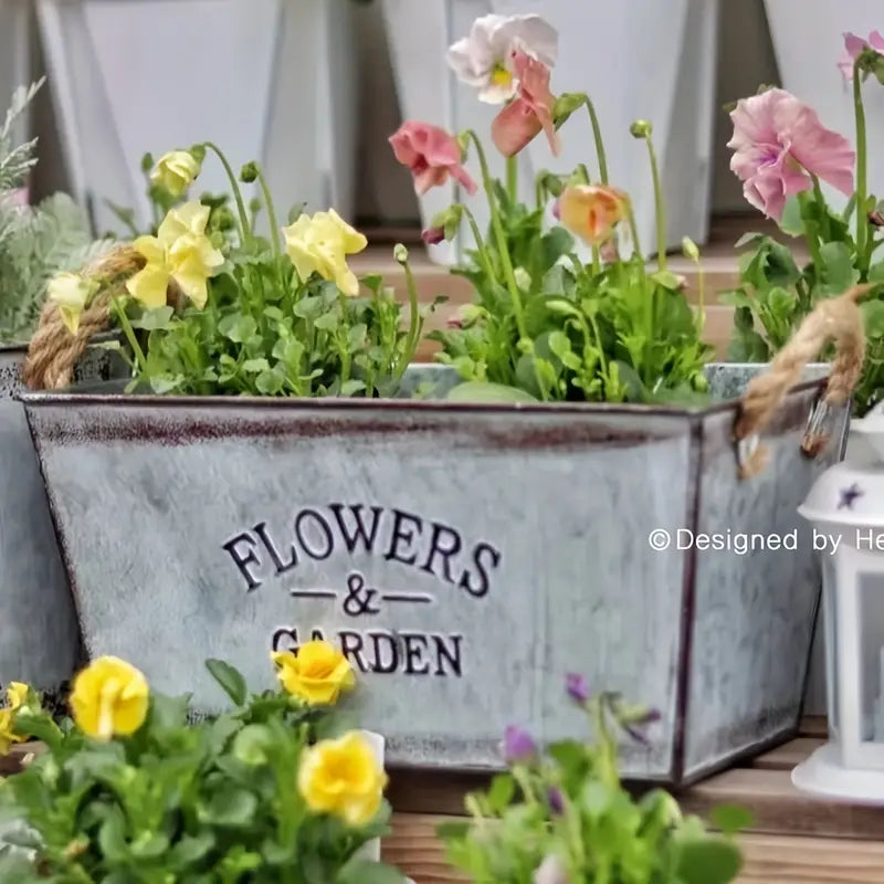 Decorative flower and garden container made of metal with hemp rope handles
