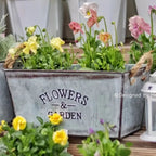 Decorative flower and garden container made of metal with hemp rope handles