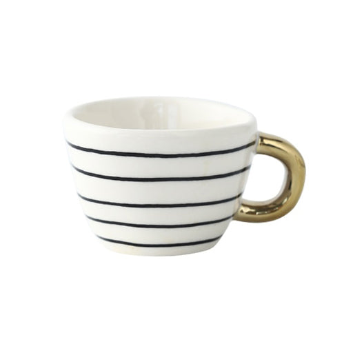 Cup with abstract geometric pattern and gold handle