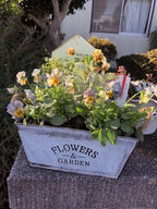 Decorative flower and garden container made of metal with hemp rope handles