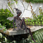 Statue of sitting fairy in the garden