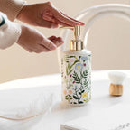 Soap dispenser made of ceramic with floral design
