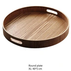 Slim, round serving trays made of wood