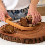 Bread knife made of wood with non-slip cutting aid