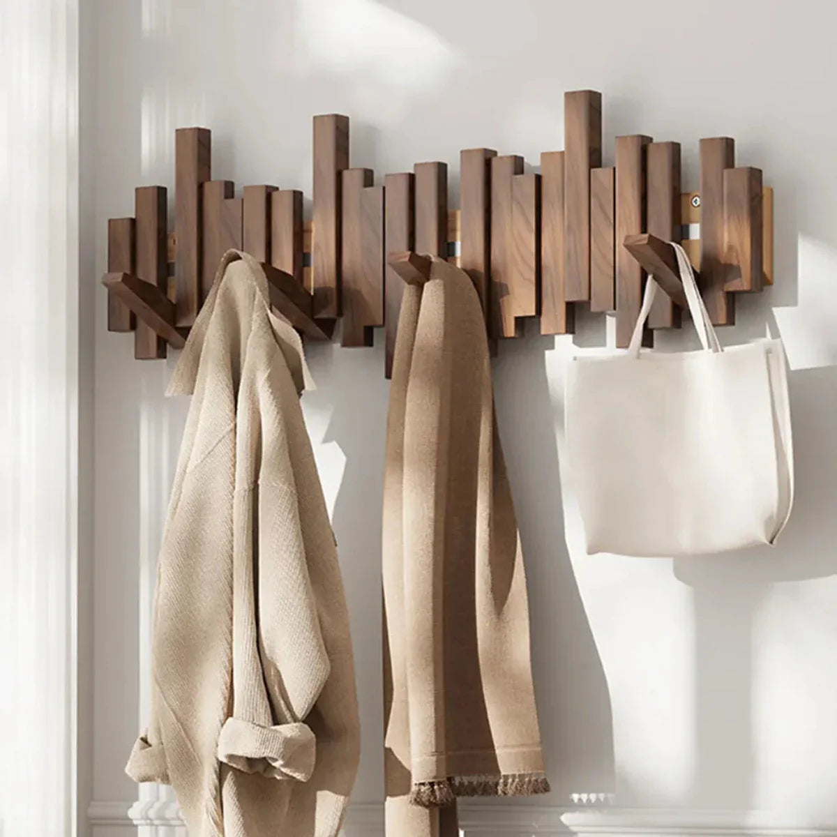 Modern piano-style hanger made of walnut and beech wood