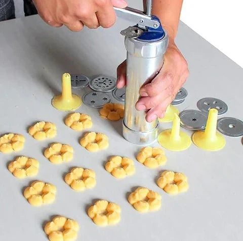 Cookie press made of stainless steel with attachments for creative cookies and pastries