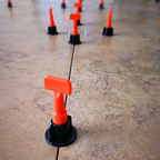 Reusable tile leveling system