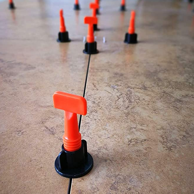 Reusable tile leveling system