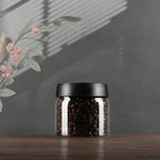 Glass coffee bean storage container with aroma protection lid for long-lasting freshness