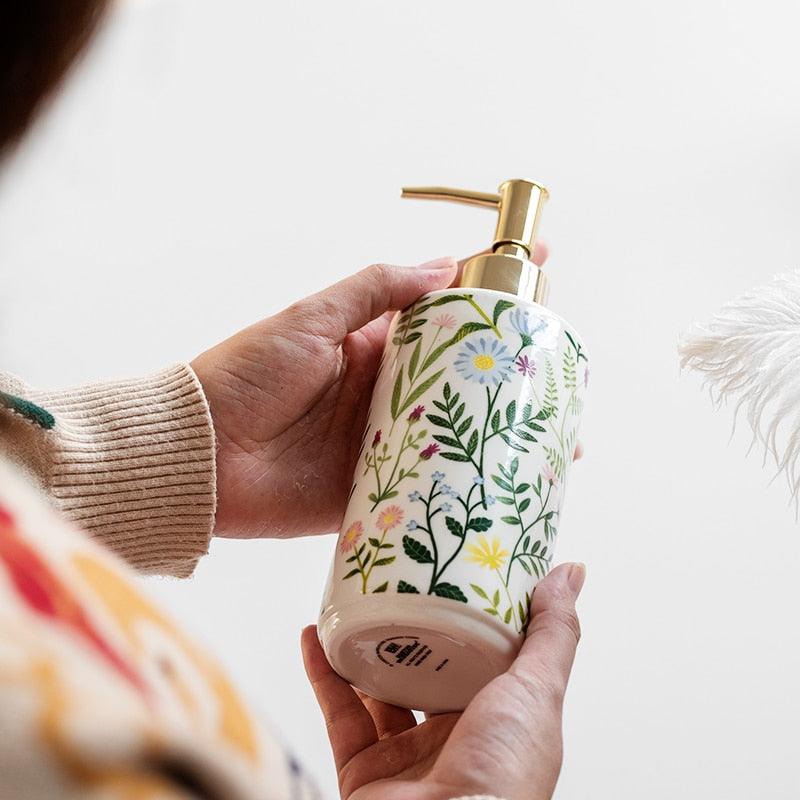 Soap dispenser made of ceramic with floral design