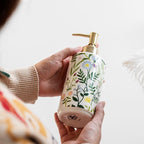 Soap dispenser made of ceramic with floral design