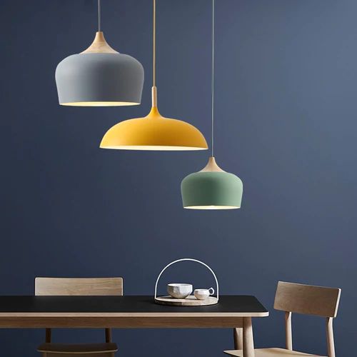 Pendant lights made of metal and wood in delicate pastel shades