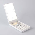 Travel makeup brush set with LED light mirror