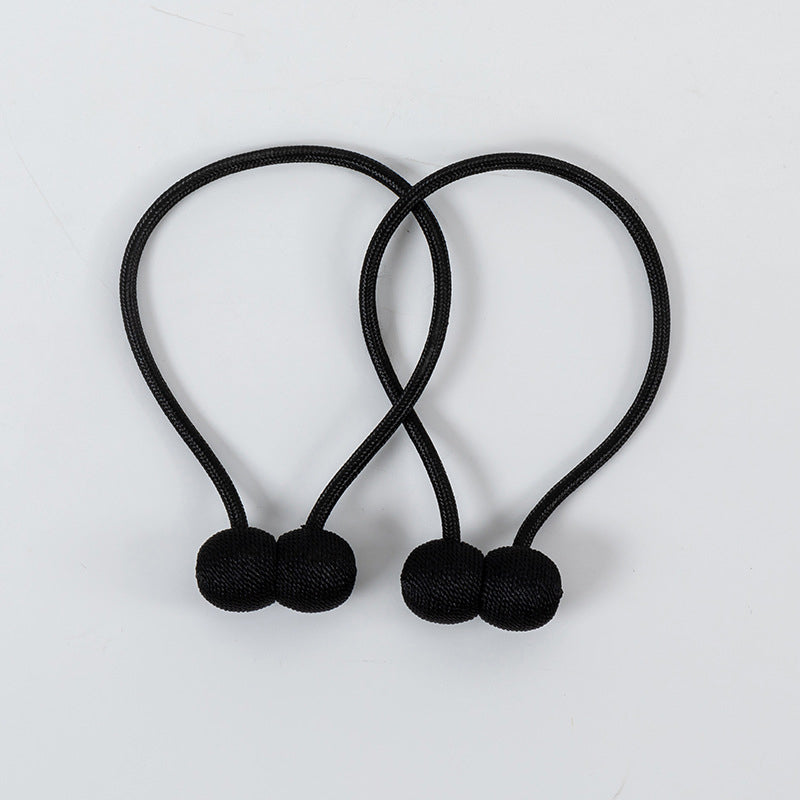 Curtain tiebacks with magnetic curtain clasp