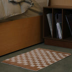 Soft, fluffy bathroom rug with check pattern