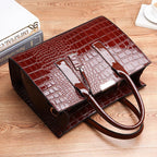 Bag with crocodile embossing.
