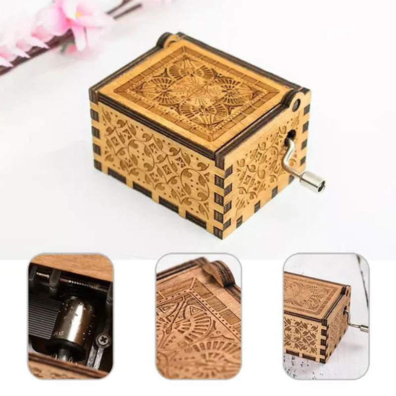 Vintage mechanical music box with hand crank