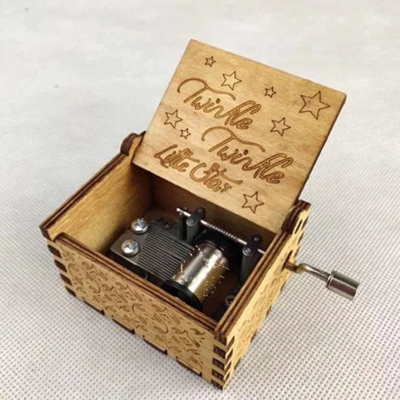 Vintage mechanical music box with hand crank
