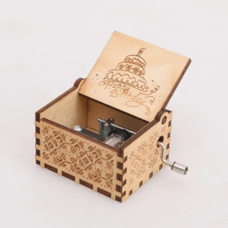Vintage mechanical music box with hand crank