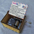 Vintage mechanical music box with hand crank