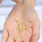 Necklace with gold-colored butterfly with tassels