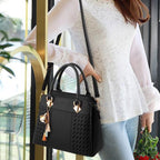 Elegant women's bag with tassel pendant