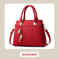 Elegant women's bag with tassel pendant