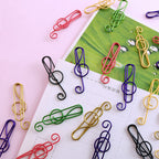 Multicolored musical clips in metal (100 pcs)