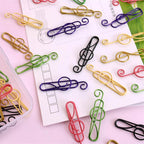 Multicolored musical clips in metal (100 pcs)