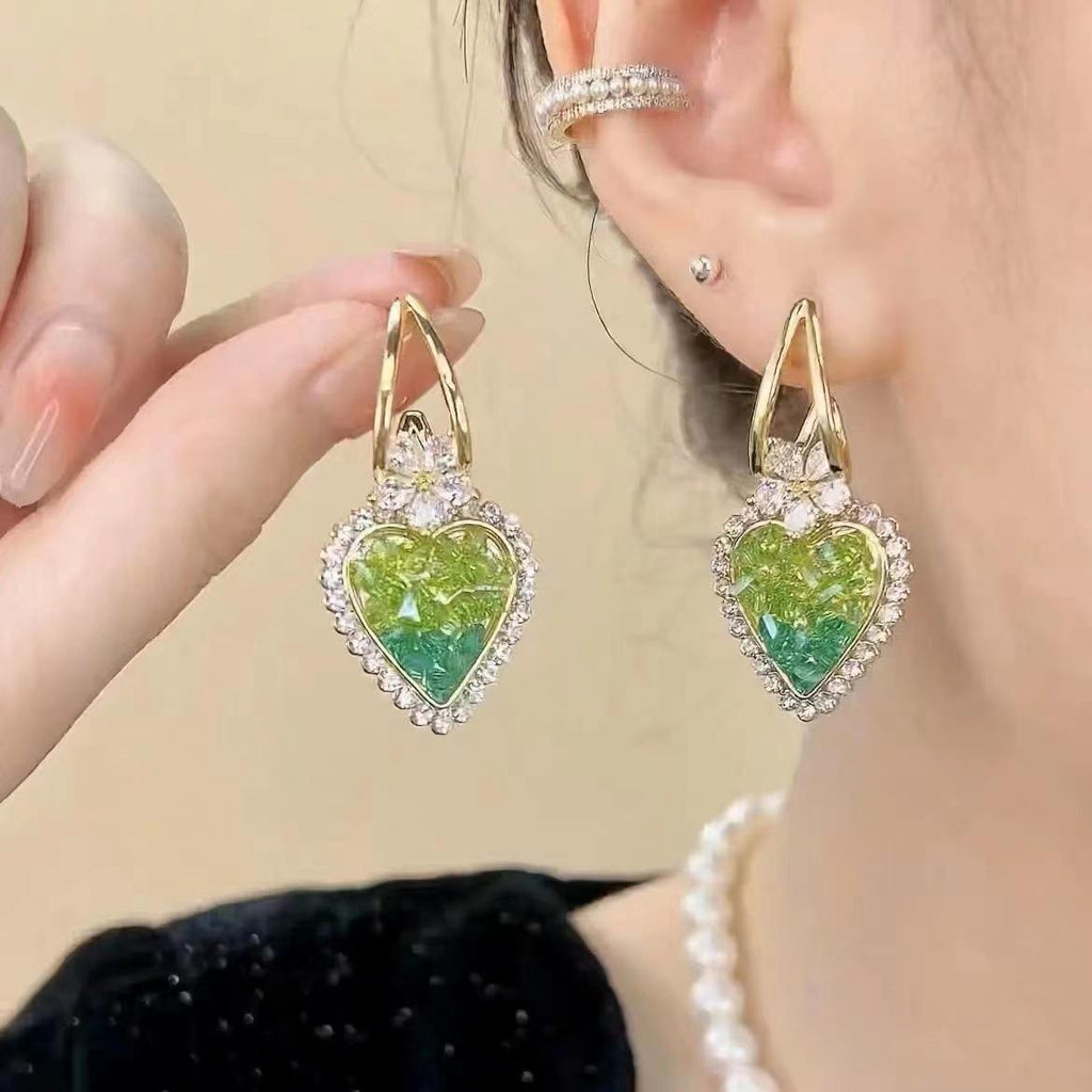 Earrings with heart in green crystals