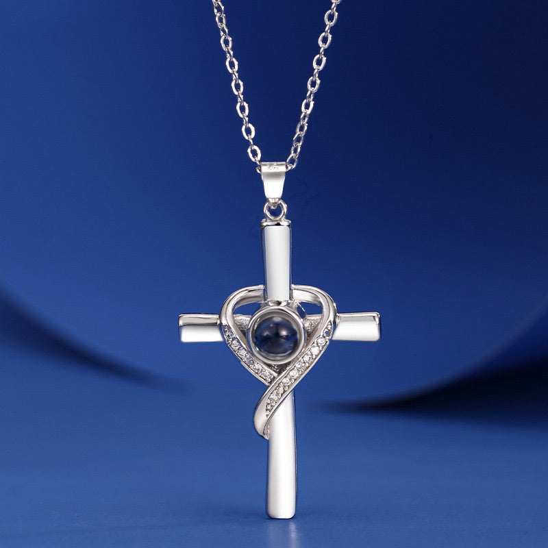 Cross necklace with "I love you" projection in 100 languages