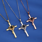 Cross necklace with "I love you" projection in 100 languages