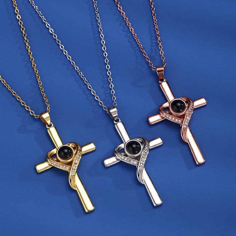 Cross necklace with "I love you" projection in 100 languages