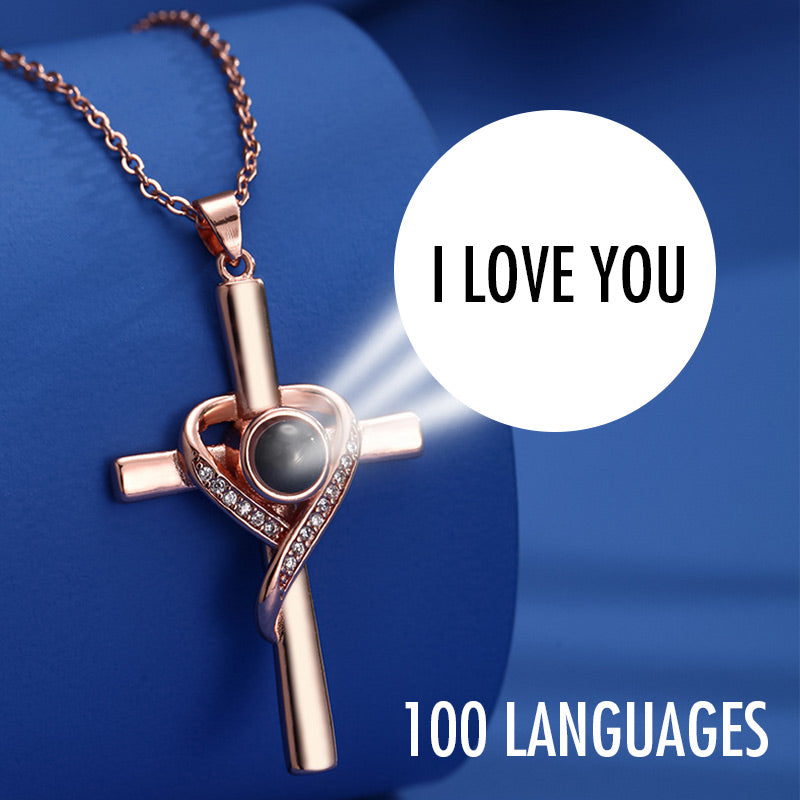 Cross necklace with "I love you" projection in 100 languages